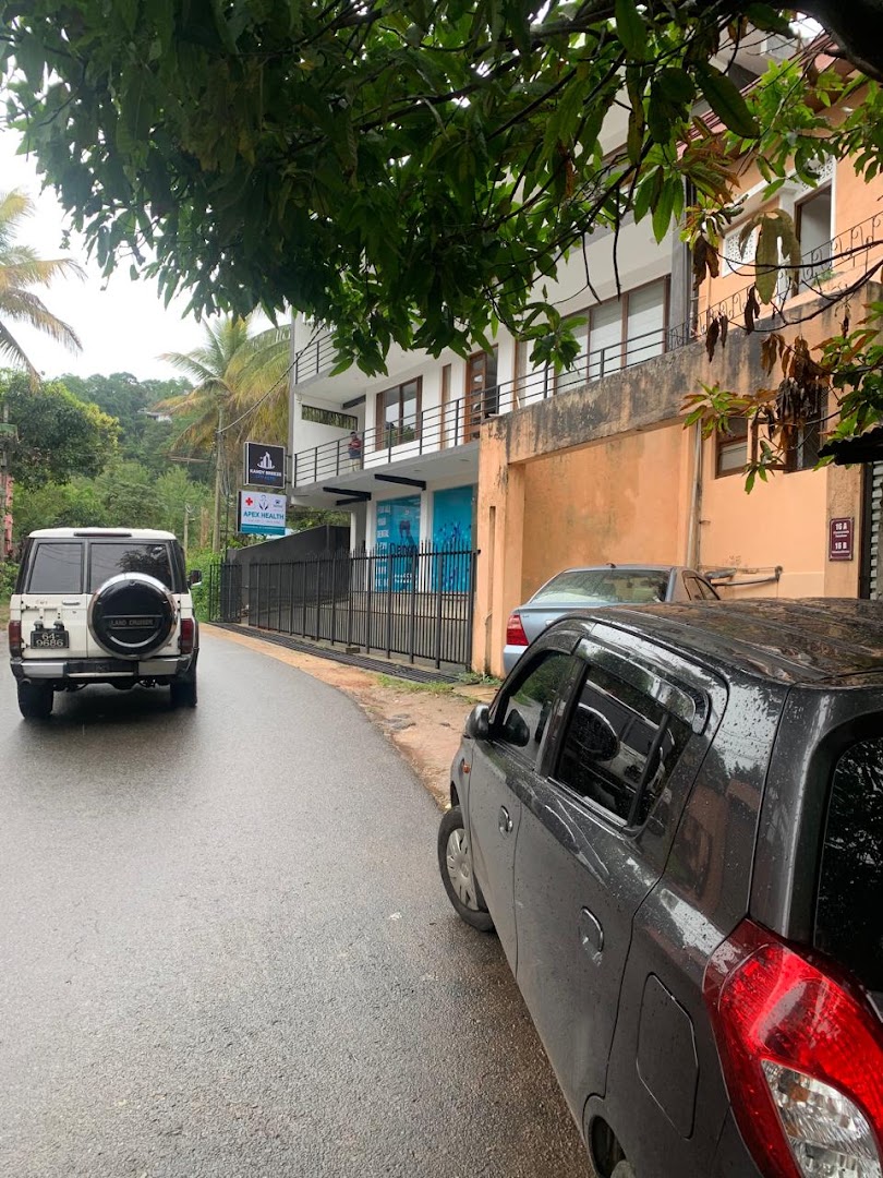 Mulgampola Road approach with the Apex Health sign visible ahead